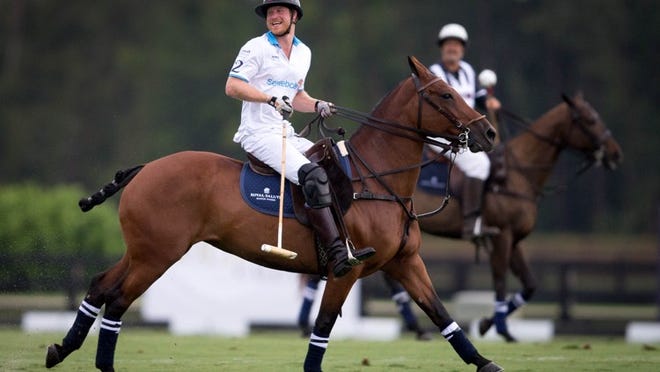 Prince Harry plays charity polo in Wellington, Florida on May 4, 2016. (Allen Eyestone / The Palm Beach Post)