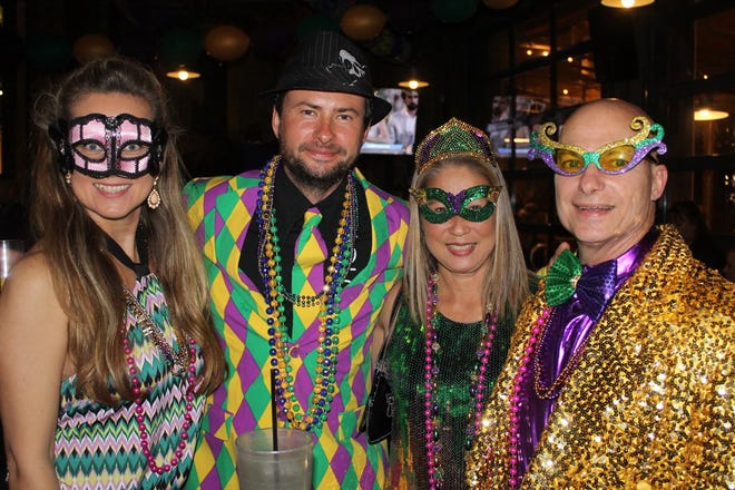 Come to LuLu’s Destin on Fat Tuesday, Feb. 13th, to celebrate Mardi Gras and 25 years of LuLu’s. Sporting their Mardi Gras attire are the Vijacka’s and the Whidden’s.
