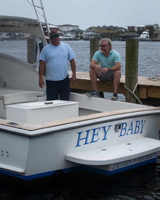 Kevin Moak, left, captain of the 30-foot 1974 G&S boat "Hey Baby," and Eddie Morgan, owner of Harbor Docks, a family-owned marina and seafood restaurant in Destin, Fla., are pictured April 1, 2024.