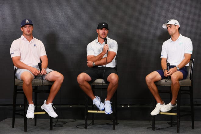 Apr 3, 2024; Miami, Florida, USA; From left, Bryson DeChambeau, Brooks Koepka and Joaquin Niemann talk to reporters during press conference at a LIV Golf Miami practice round at Trump National Doral. Mandatory Credit: Sam Navarro-USA TODAY Sports