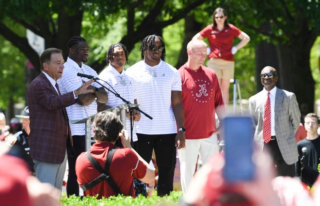 Apr 13, 2024; Tuscaloosa, AL, USA; Former Alabama coach Nick Saban speaks at the permanent captains enshrinement. At his side are Jalen Milroe, Malachi Moore, Dallas Turner and new head coach Kalen DeBoer at the Denny Chimes on the Quad at the University of Alabama. Mandatory Credit: Gary Cosby Jr.-USA TODAY Sports
