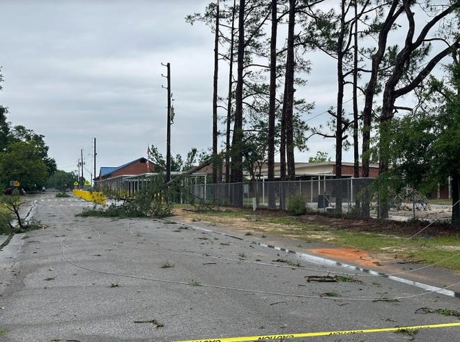 A tree is down outside of Northwood Elementary School in Crestview on Friday, May 10, 2024. Storms moved in earlier in the day, causing widespread damage.