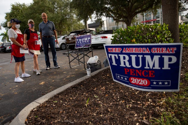 Republican Party volunteers Sharon Sims, left, Harry Steinberg and Jackie Mortman campaign for their candidates, Monday, Oct. 19, 2020, at the Norris Center in Naples.