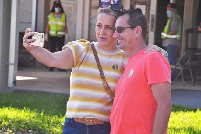 A trend this year is selfies, with the Voting signs behind them after people vote. Corolia and Alain Mazaudon take a selfie at Kiwanis Island after voting. With Saturday being the last day for early voting, early voting sites in Brevard County were busy throughout the day on Friday.