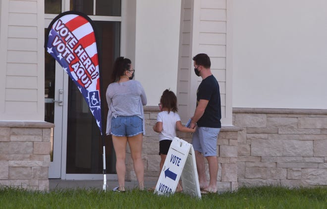 Voters head in to vote at the Joe Lee Smith Community Center in Cocoa. With Saturday being the last day for early voting, early voting sites in Brevard County were busy throughout the day on Friday.