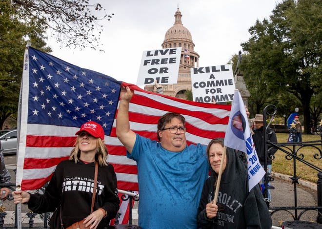 Trump supporters Kelly Lewis, left, and her parents Thomas and Kathy Smith protest the election at the Capitol on Wednesday January 6, 2021.
