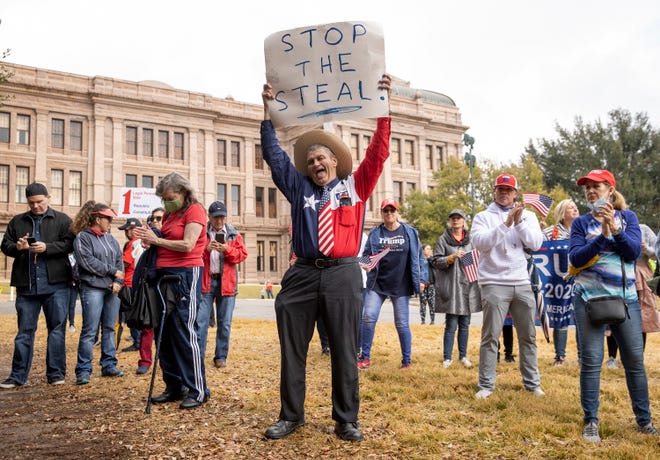 Jack Finger, of San Antonio, protests the election with supporters of President Trump at the Capitol on Wednesday January 6, 2021.